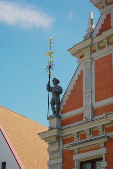 Ancient warrior on the roof of building as an architecture decoration