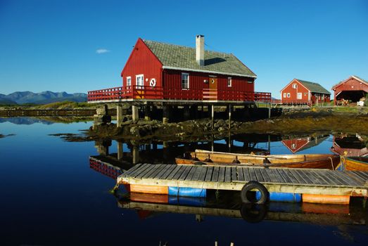 Houses on the sea coast and boats