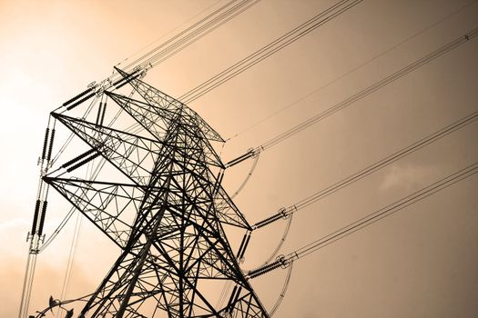 Electricity pylons with long cable at day