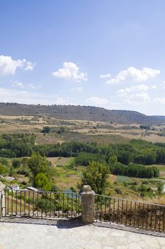 View along the river Tajo, with fields. Brihuega, Spain