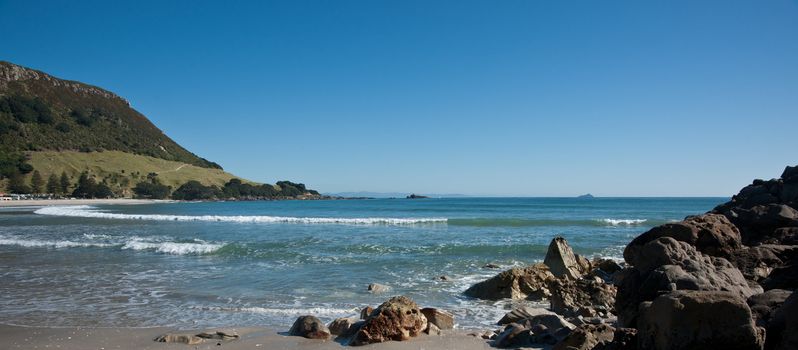 Sea view, framed by rock outcrop and mount, Mount Maunganui, New Zraland.