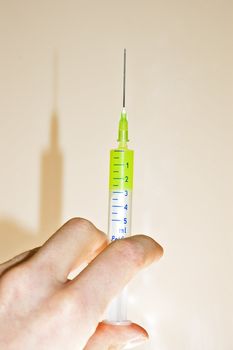 Syringe in hand