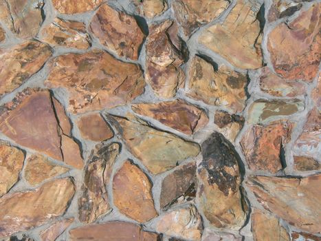 Brown flagstone wall as background texture