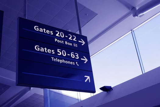 Airport Interior Architecture, Directions Sign And Glass Facade - Blue Toning