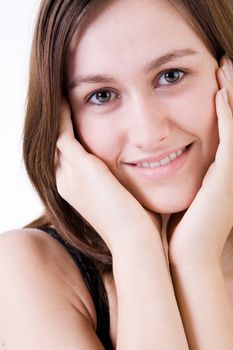 Young woman portrait in the studio on a white background