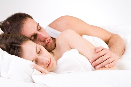 Young adult couple in the studio sleeping