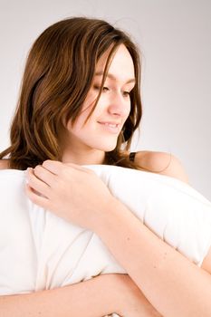 Young woman portrait in the studio on a white background