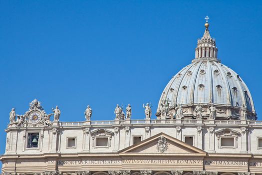Statues in St. Peter Square (Rome, Italy) with blue sky background
