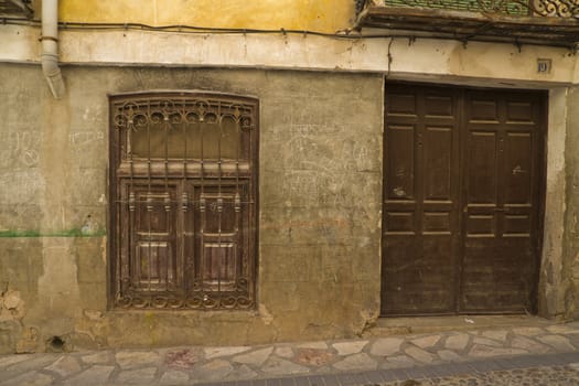 Old street with rusty walls, Brihuega, Spain.
