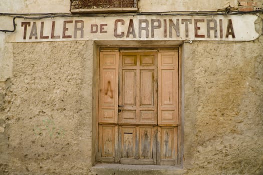 Old street with rusty walls, Brihuega, Spain.