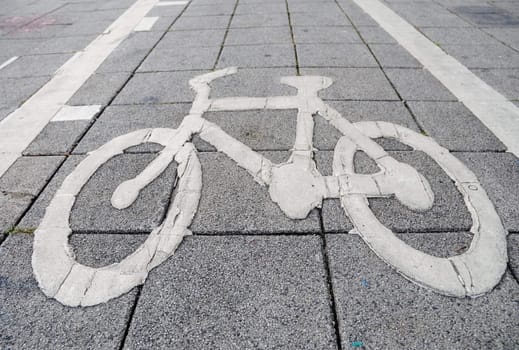sign of bike lane on footpath