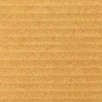Brown corrugated cardboard sheet useful as a background