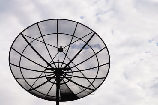 Sattelite dish in the cloudy sky