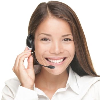 Customer Service woman smiling talking on headset. Close up portrait of beautiful young Caucasian / Asian. 