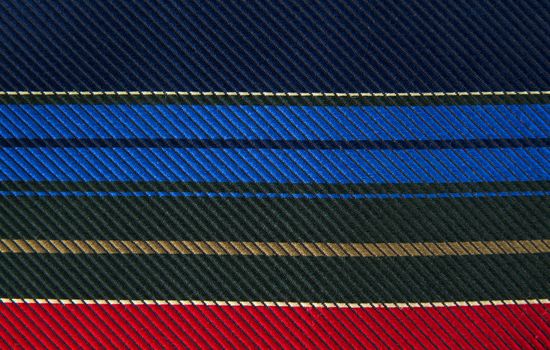 Closeup view of a striped neck tie, could be used as a background.