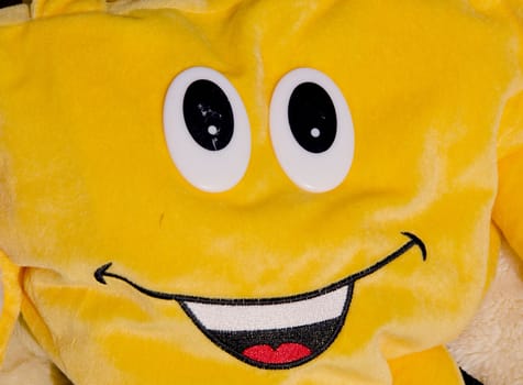 Just smile. Material toy with two big eyes and beautiful smile.