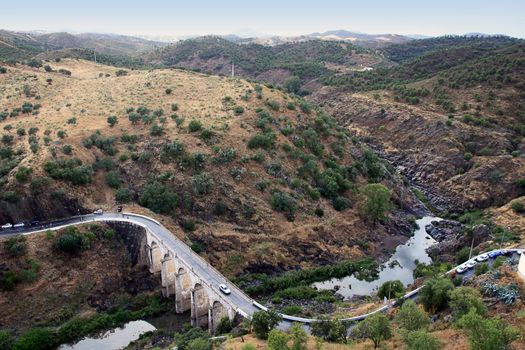 View of M�rtola's bridge with mountains and a river.