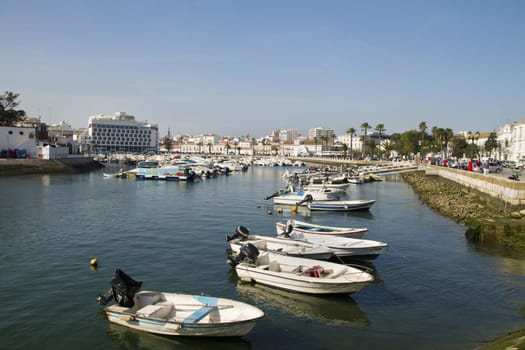 View of the marina with traditional fishing boats on Faro,  Portugal.