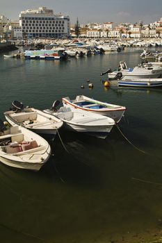 View of the marina with traditional fishing boats on Faro,  Portugal.