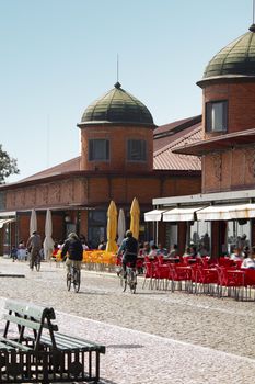 View of the traditional market area of the city of Olhao in Portugal, with people walking around.