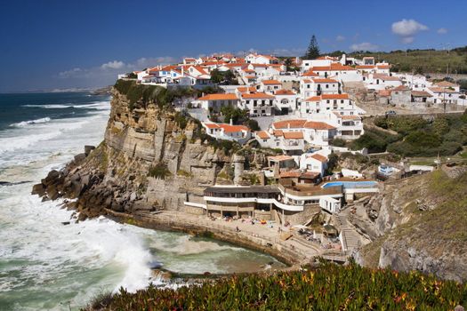 View of the famous town, Azenhas do Mar, located on the steep cliffs near the Sintra region on Portugal.