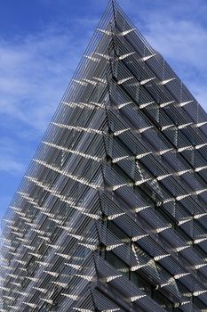 Upward view of the corner of a modern building.