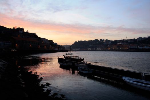 View of the river "Douro" dividing Porto and Gaia cities at the dawn of day in the north of Portugal.
