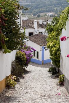 Typical street view of the ancient Obidos village located on Portugal.