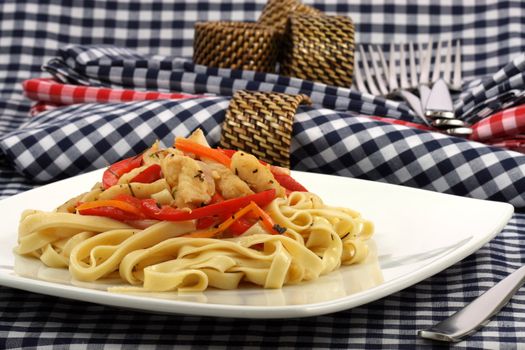 Gourmet exquisite halibut  fettuccine pasta  on fancy dinner plate   