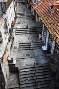 Down view of an old decaying street with stairs.