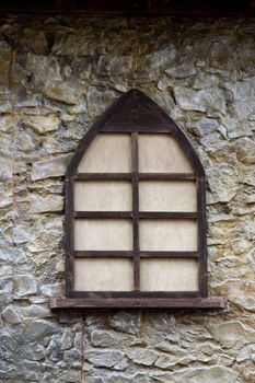 Close up view of an old medieval wooden window.