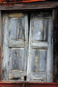 Close view detail of an old wooden broken window.