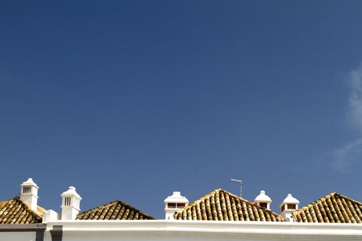 View of typical tiled rooftops on the Algarve region, Portugal.