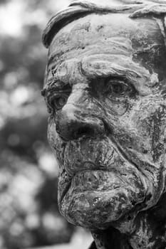 Close up view of a black and white stone staue.