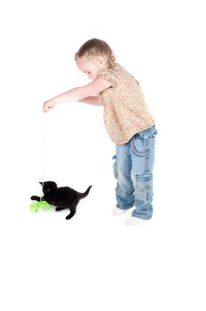 Shot of little girl playing with kitten