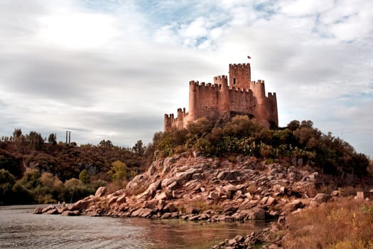 view of the beautiful Almourol Castle located on the Tagus River on Portugal.