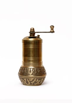 Vintage bronze brass pepper mill isolated on white background with clipping path