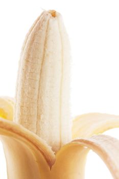 Closeup view of peeled banana isolated over white.