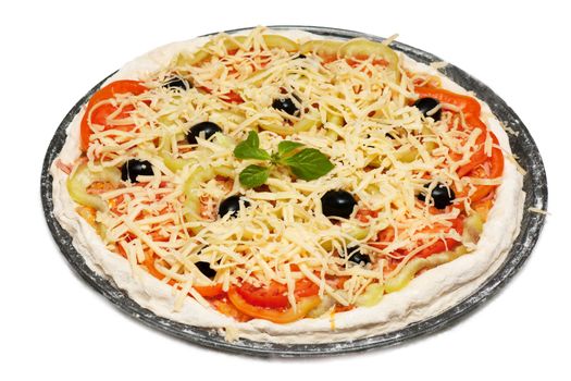 Uncooked vegetarian pizza isolated on white background