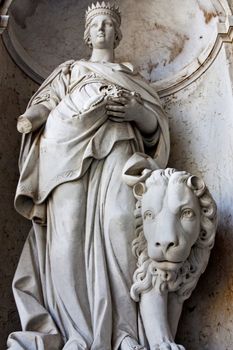 Close view of a statue of a women located on the entrance of the National Palace of Ajuda in Lisbon, Portugal.