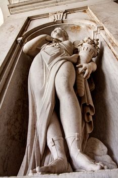 Close view of a statue of a women located on the entrance of the National Palace of Ajuda in Lisbon, Portugal.