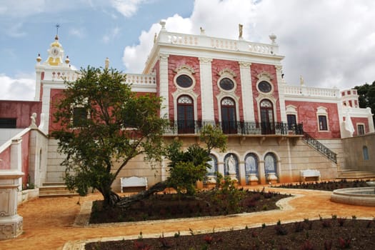 View of the park and fore part of the Palace of Estoi village located on the Algarve, Portugal.