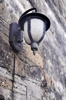 Old lamp on the brick wall