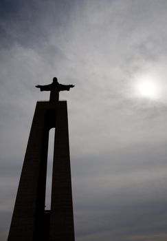 View of the tall stone statue of King Christ on Almada, Portugal.