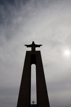 View of the tall stone statue of King Christ on Almada, Portugal.