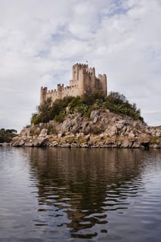 View of the beautiful Almourol castle located on a small island on the middle of the Tagus river, Portugal.