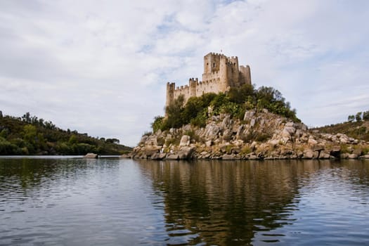 View of the beautiful Almourol castle located on a small island on the middle of the Tagus river, Portugal.