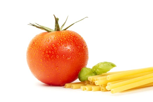 raw macaroni with basil and tomato on white background