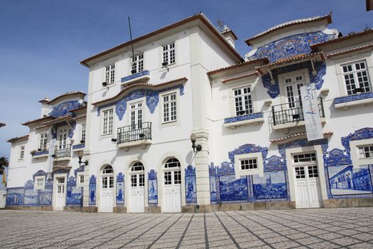 View of the historical train station building featuring the famous azulejo tiles on the walls in Aveiro-Portugal.