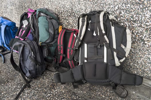 Backpacks near an airport wall ready to leave